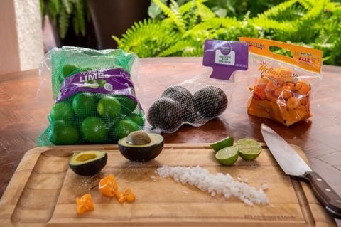 Finished produce packs: printed mesh and poly bags holding limes, onions and peppers